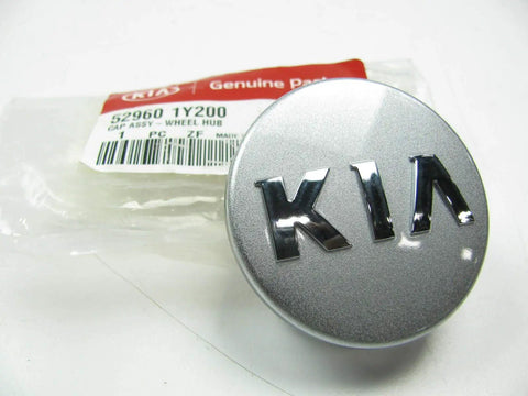 Kia Wheel Hub Cap Assembly 52960-1Y200 OEM new center cap with Kia logo and packaging visible