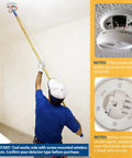 Extra Long 11 Foot Smoke Detector Removal Tool With Two Interchangeable Heads And Pro Gear Bundle reaching a smoke alarm on a high ceiling.