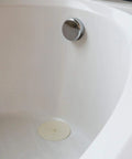 5 Inch Flat Suction Rubber Sink Stopper Fits Most Kitchen And Bathroom Sinks And Tub Drains White Durable Rubber Corrosion Resistant Easy To Use No Fuss Quick Seal For Stopping Water in white bathtub.