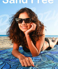 Woman sunbathing on Ultra Thin Lightweight Microfiber Beach Towel With Carry Strap Sand Free Quick Dry Absorbent