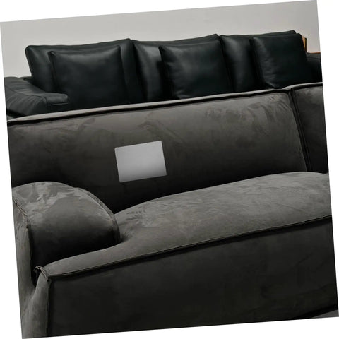 Grey self adhesive linen repair patch kit, 5 pieces, applied to dark upholstery for quick fabric fixes on furniture surfaces.