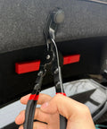 Heavy Duty Carbon Steel Panel Clip Pliers For Automotive Door Trim And Upholstery Removal Plus Chrome Coated Design shown in use on a trim fastener.