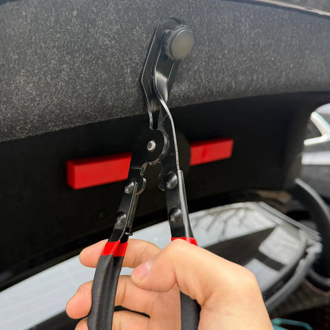 Heavy Duty Carbon Steel Panel Clip Pliers For Automotive Door Trim And Upholstery Removal Plus Chrome Coated Design shown in use on a trim fastener.