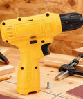 No Sweat Cordless Drill Set With Cushioned Anti Slip Handle and Bulletproof Performance on a workbench surrounded by tools.