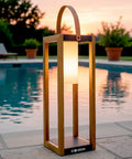 Rustic Solar Lantern For Outdoor Use With Portable Handle by pool at sunset, 22-inch tall, wooden finish, illuminating softly.