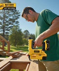 Man using Badass Two In One Cordless Brad Nailer And Quarter Crown Stapler outdoors on wooden planks for DIY project.