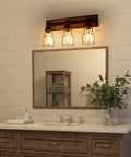 Bathroom setting with two light farmhouse vanity light with vintage black metal cage and rustic wood finish above mirror