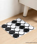 16 Pack Furniture Sliders 1.5 Inch Black Heavy Duty Glide Mats for Carpet And Hardwood Floors on wooden floor.