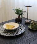 Hecka Smooth 13.4 Inch Round Lazy Susan Countertop Turnable Tray Featuring Mother Of Pearl Center And Black Wicker Boho Pattern with cake slice.