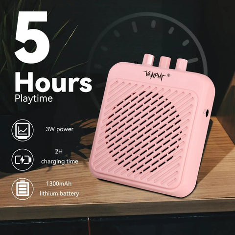 Mini 3W Rechargeable Bluetooth Guitar Amp With Dual Channel Clean And Overdrive For Indoor Practice And Travel, Portable Tiny Pink Amp With 5 Hour Battery Life on wooden table with power details.