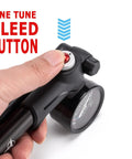 Close-up of High Pressure Shock Pump For Mountain, Road Bikes And Motorcycles With Gauge, 300 Psi Capacity, finger on bleed button