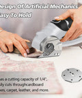 Super Lightweight Cordless Electric Scissors With 4V Battery And LED Light cutting fabric on a table, featuring ergonomic design.