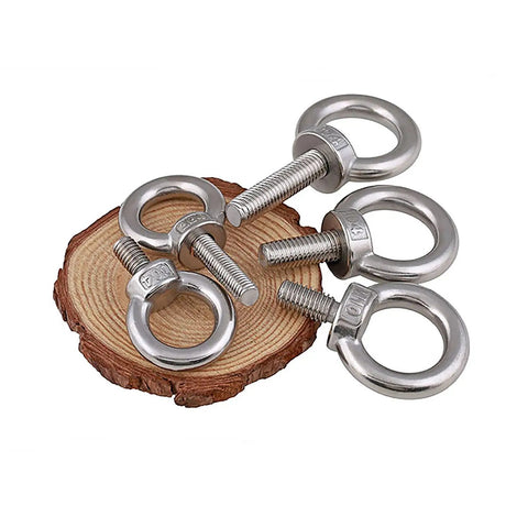Five stainless steel shoulder eye bolts on wood slice, Stainless Steel Shoulder Eye Bolt With Nut For Lifting Built Tough SS304 Hardware Kit M3 To M20 Metric Range Industrial Construction Grade Corrosion Resistant Eye Bolt Set Includes Five M10 By 100mm Bolts.