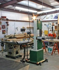 Workshop with various tools and equipment for woodworking and crafts.
