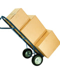 Hand truck with 8x1.75 Inch Semi Pneumatic Tire On Wheel With Offset Hub For Hand Trucks Dollies Generators Pressure Washers And Other Utility Equipment Built For Easy Replacement And Smooth Rolling In Tough Worksites loaded with boxes