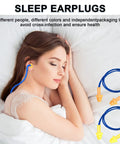 Woman sleeping with corded silicone earplugs, blue and yellow design, illustrating Corded Silicone Earplugs Bulk 200 Pairs Reusable Noise Cancelling