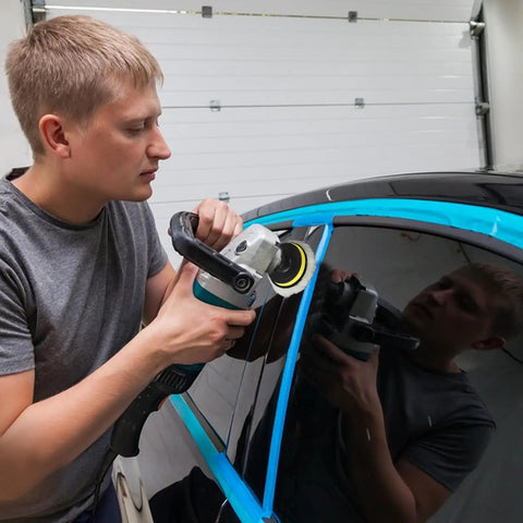 Man using 11Pcs Pro Grade Car Buffing Pads For Drill Polishing Kit with adapter on car window for scratch-free finish