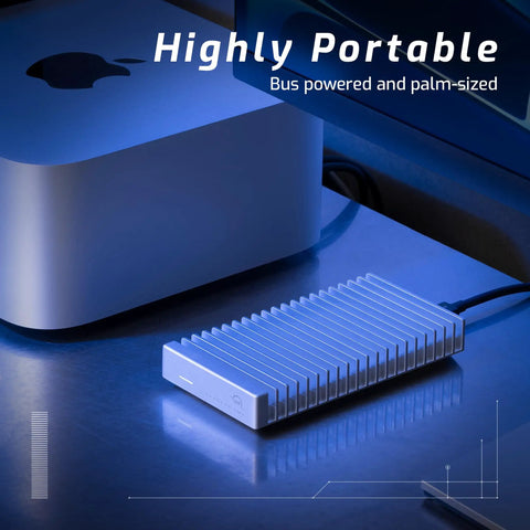 Express 1M2 Portable NVMe SSD Enclosure With USB4 Thunderbolt Compatible USB C Aluminum Heat Sink on desk beside computer