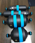 Float Arm D52 220 for underwater photography on table, blue and black with Nauticam bayonet mount