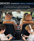 Upgrade Your Daily Whip With This Four Port 12V USB Car Charger Featuring Bright LED Voltmeter And Dual PD30W QC18W Fast Charging Ports Crafted From Rugged Aluminum Alloy For Every Cruiser Setup, showing 4 devices charging in a car.