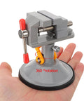 Multi Functional Rotating Bench Vise With Swivel Tabletop Clamp held in hand showcasing 360-degree rotation and compact design.
