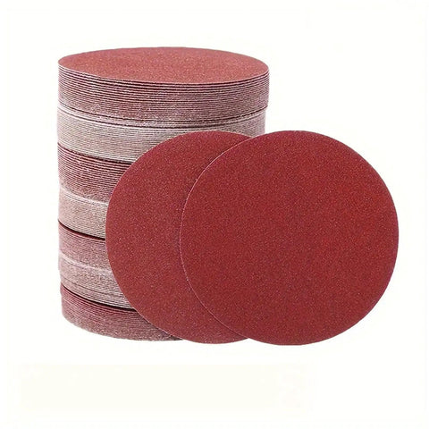 Premium 5 Inch Hook And Loop Sanding Discs With Durable Aluminum Oxide abrasive For Heavy Duty Wood Metal Work In 60 To 1000 Grits stacked and loose discs.