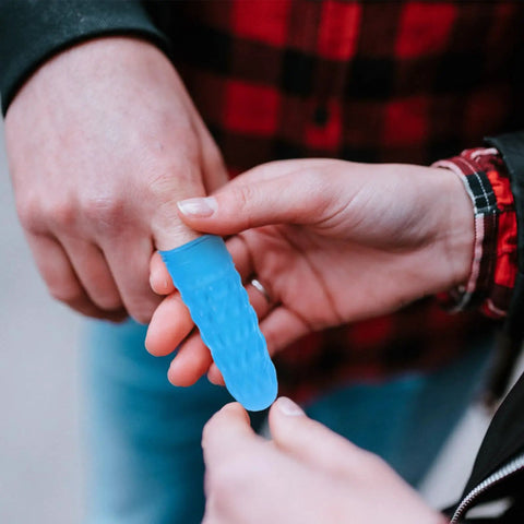 Top Tier Blue Butyronitrile Finger Sleeves 100 Count Anti Static Hand Guards being applied to a finger for protection.