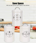 Boost Your Pantry Game With This Three Piece Airtight Kitchen Storage Jar Set Crafted From Thick Powder Coated Iron Heavy Duty Lids. White jars labeled tea, coffee, and sugar.
