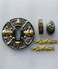 Dope Alloy Tsuba Fuchi Kashira Menuki Set for Samurai Sword Handle Upgrade with skull design, gold details on white background