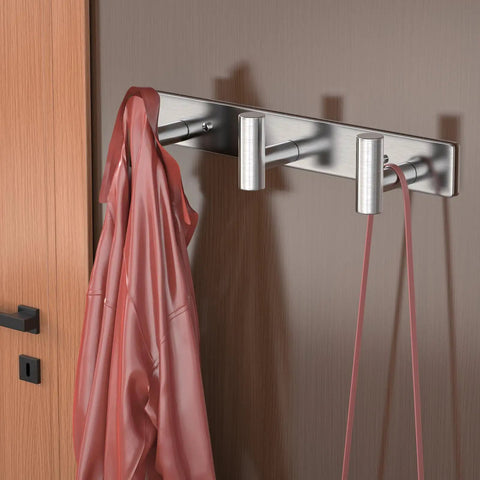 Stainless Steel Wall Mount Coat Hooks Set With Three T Shaped Hooks For Coats Bags Towels And Accessories Heavy Duty Rust Proof Wall Hanger Easy To Install Silver Finish holding a pink coat and belt.