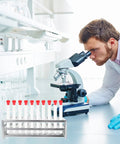 Premium Aluminum Test Tube Rack Stand For Lab Safety with small test tubes in a lab setting next to a microscope.