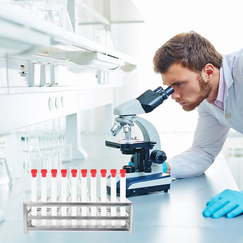 Premium Aluminum Test Tube Rack Stand For Lab Safety with small test tubes in a lab setting next to a microscope.