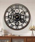 Large Farmhouse Wall Clock For Living Room Decor Visible Gear Dial with black and gold design, mounted on white wall, battery operated.