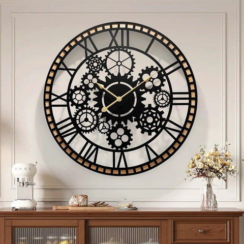 Large Farmhouse Wall Clock For Living Room Decor Visible Gear Dial with black and gold design, mounted on white wall, battery operated.