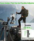 Man hiking with Pro Grade Adjustable Laser Level Tripod Extends Up To 62 Inch holding phone, showcasing flexible holder.