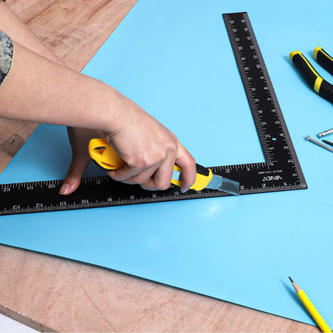 Carpenter Framing L Shape Square 16 Inch By 24 Inch Steel With White On Black Markings used for cutting blue sheet in workshop