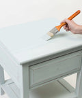 Hand painting side table with Serenity Blue Chalked All In One Furniture Paint With Ultra Matte Finish For DIYers One Coat Coverage