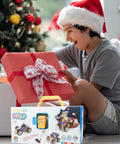 Child with Santa hat opening gift box, revealing 10 In 1 STEM Toys For Kids Ages 4 5 6 7 8 Build Kit With Electric Motor.