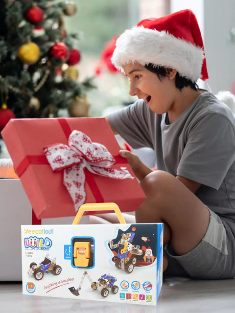 Child with Santa hat opening gift box, revealing 10 In 1 STEM Toys For Kids Ages 4 5 6 7 8 Build Kit With Electric Motor.