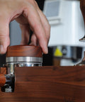 KNODOS 54mm espresso distribution tool with rosewood knob and stainless steel body, adjustable leveler