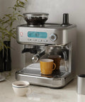 Straight Up Game Changer Espresso Machine With Built In Grinder And Genuine 20 Bar Pressure Stainless Steel Coffee Maker on a countertop.