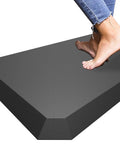 Ultra Thick 0.8 Inch Anti Fatigue Kitchen Mat 17X30 Inches Cushioned Floor Rug Waterproof with feet stepping on the black mat.