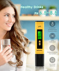 Digital Water PH Tester With 0.01 Accuracy And 0 To 14 PH Range For Hydroponics Drinking Water Pools Aquariums And Home Labs Easy To Use With Bright LED Backlit Display For Clear Readouts Even In Low Light next to a smiling woman holding a glass of water.