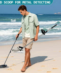Man using sand scoop for metal detecting and treasure hunting stainless steel shovel with adjustable length on beach