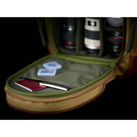 Open view of Rucksack 25 Camera Bag For DSLR Gear With Tablet Pocket, Padded Dividers, and Drawstring Closure, showing interior compartments.