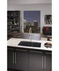 Modern kitchen with black cabinetry featuring Hopewell Steel Bar Pull M993 15 Inch Center-To-Center Flat Black Cabinet Pulls.