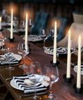 Elegant dining setup with 24 Pack Flameless Taper Candles Battery Operated LED Candles With Realistic Flicker, 11 Inch Ivory Tapered Candles.
