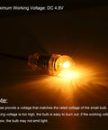 Heavy Duty E10 Miniature Bulbs With A Sweet Warm Yellow Glow And Secure Metal Screw Base built for flashlights, showing illuminated E10 bulb.