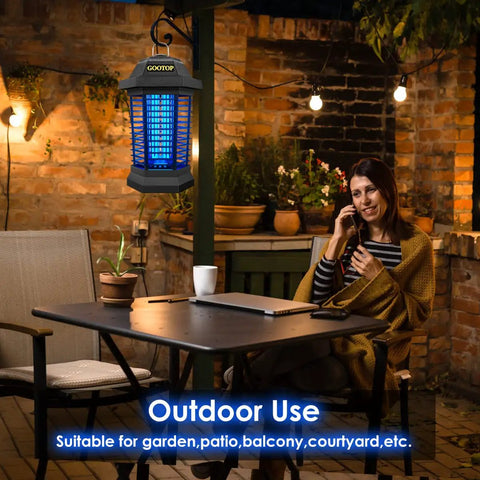 Outdoor Bug Zapper That Actually Works 4200V Electric Mosquito Killer with 3 Prong Plug on patio near woman with phone