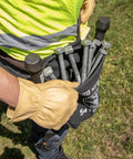 Person wearing Flame Resistant No 4 Canvas Tool Bag For Bolt Storage With Tunnel Belt Loop And Double Reinforced Bottom